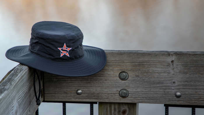 Shademaker II bucket hat sitting on porch rail