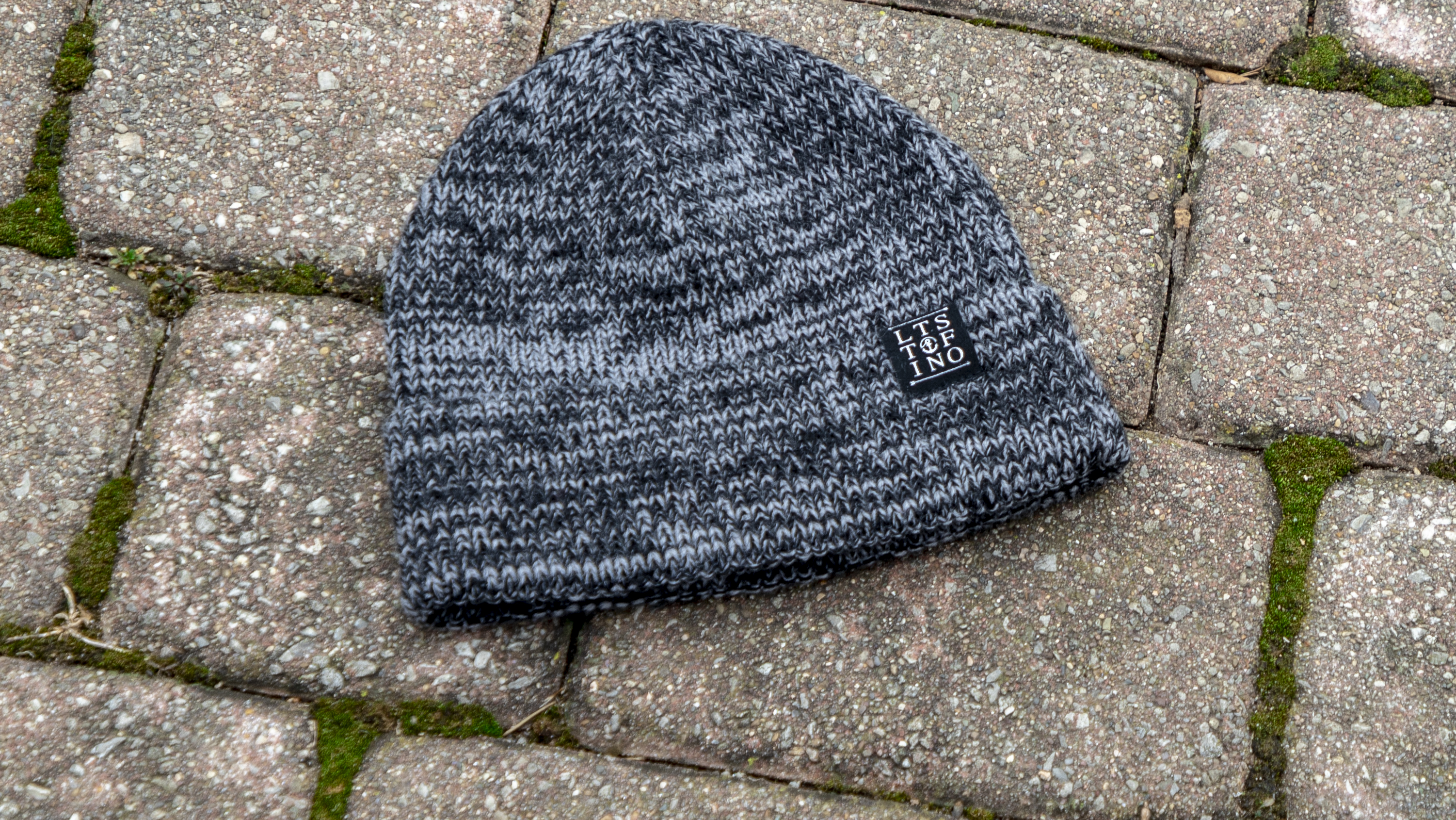 Woodberry Knit laying on stone path