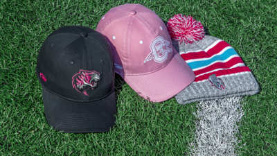 Ladies hats sitting grass field
