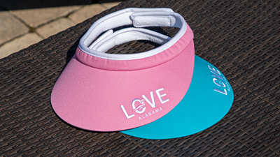 Ladies Velcro Visors on an outdoor table