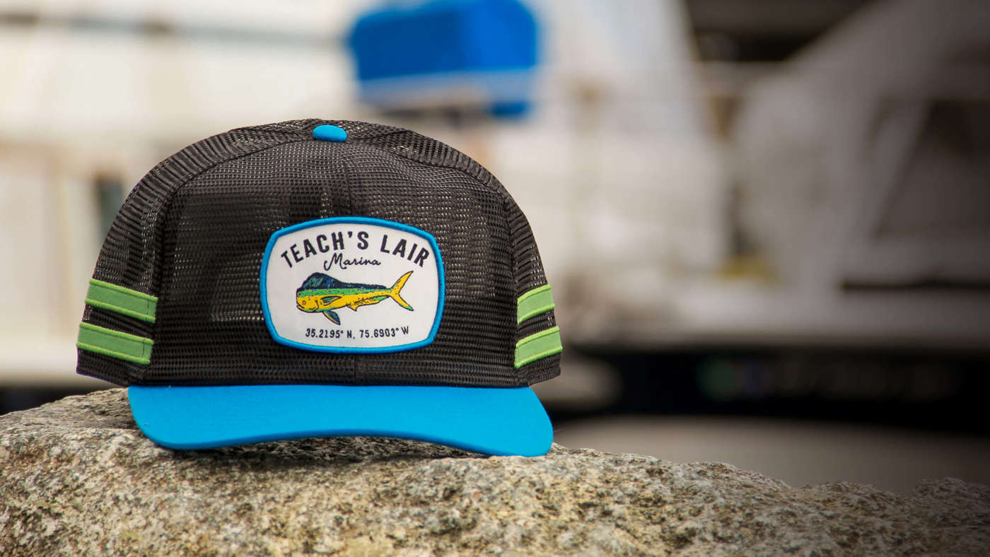 Outdoors hat sitting dockside