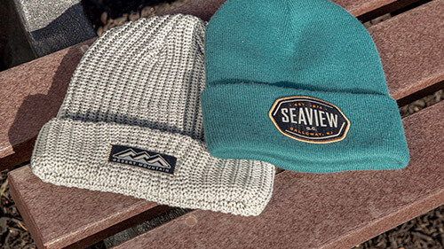 Cold Weather Knits resting on a bench