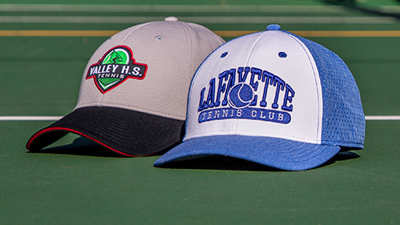 Team Sports Tennis hats on a hardcourt