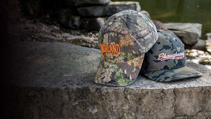 Camo boonie & hats sitting by a stream