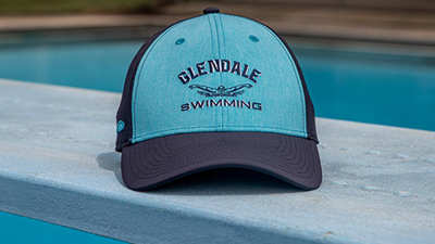 Team Sports Swim & Dive hat on a diving board