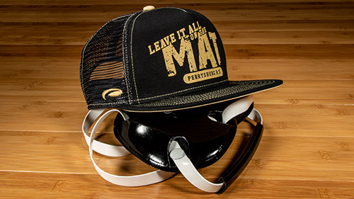 Team Sports Wrestling hat on top of headgear