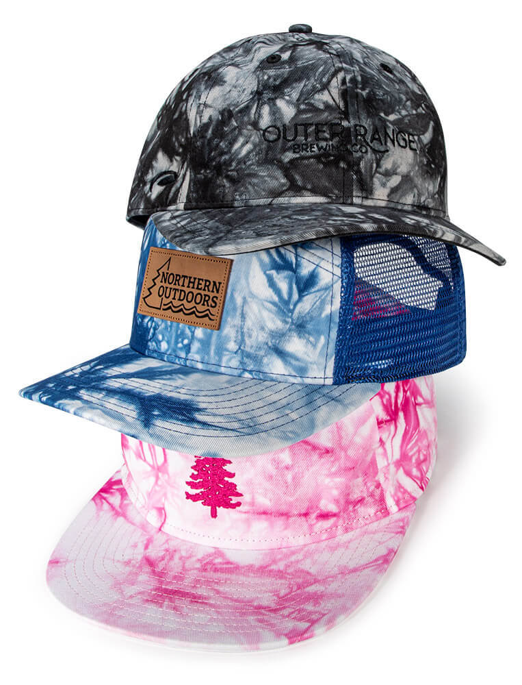 Stack of Custom Hats featuring Tie-Dye Specialty Fabric