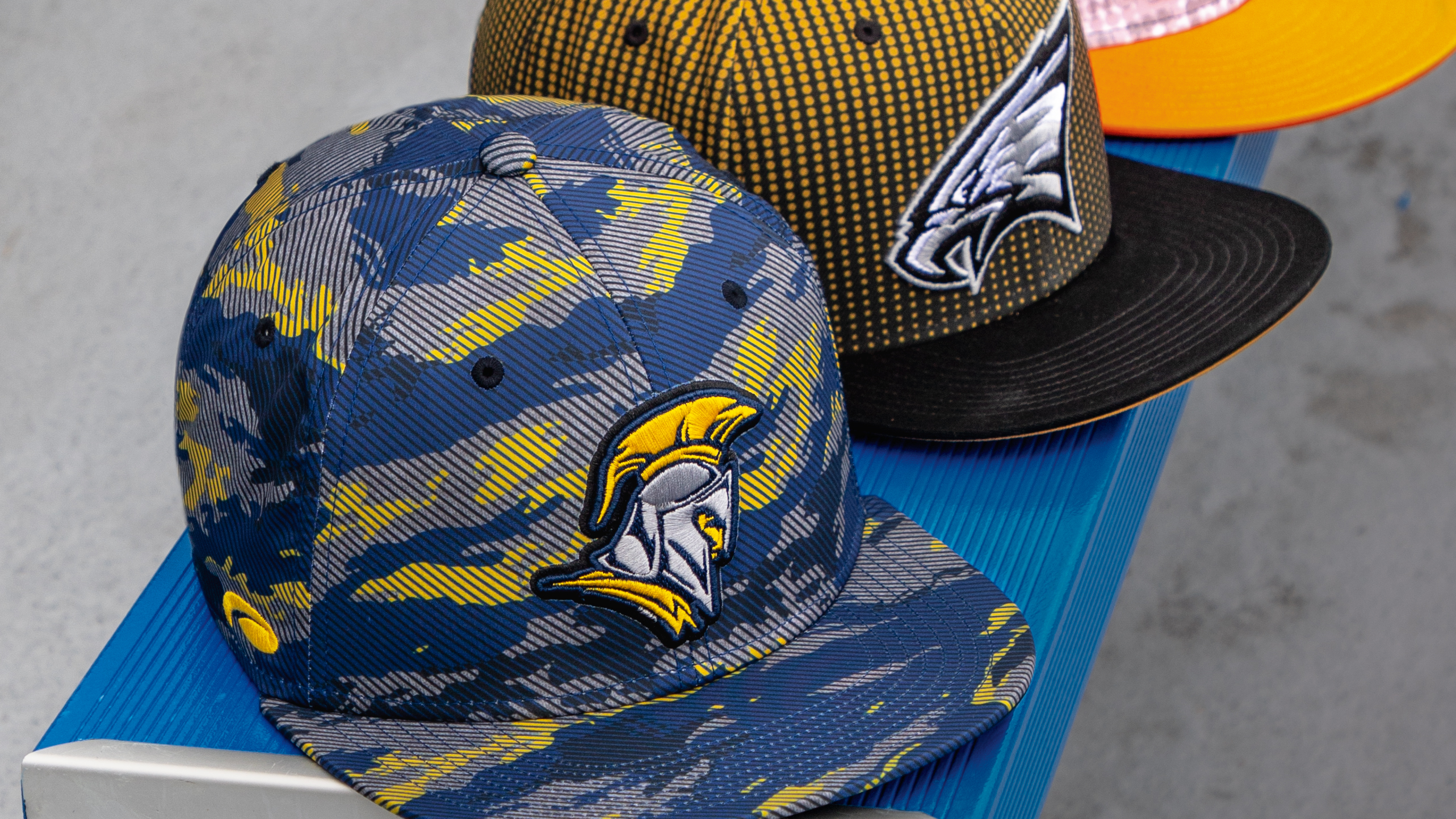 Pukka Hats lined up on a bench