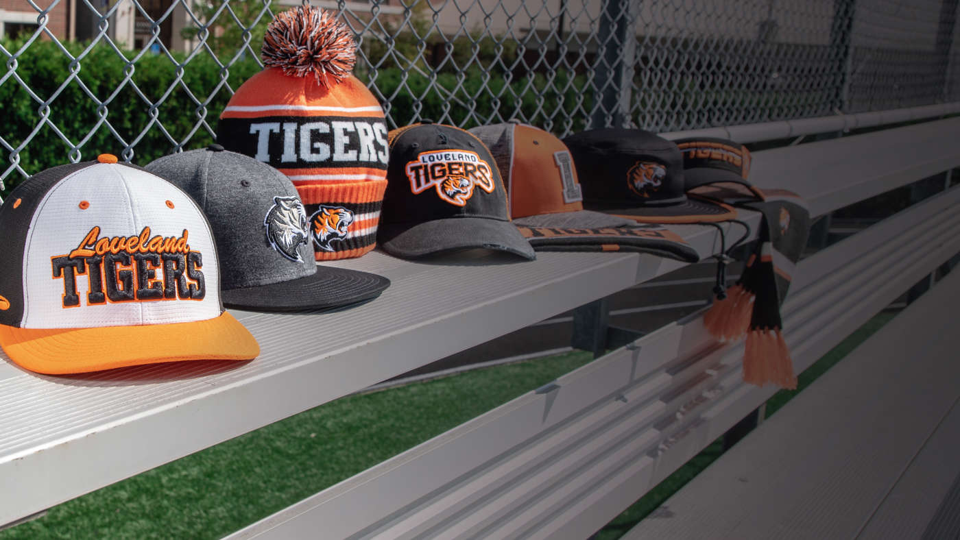 Total School Solution hats sitting on bench seat