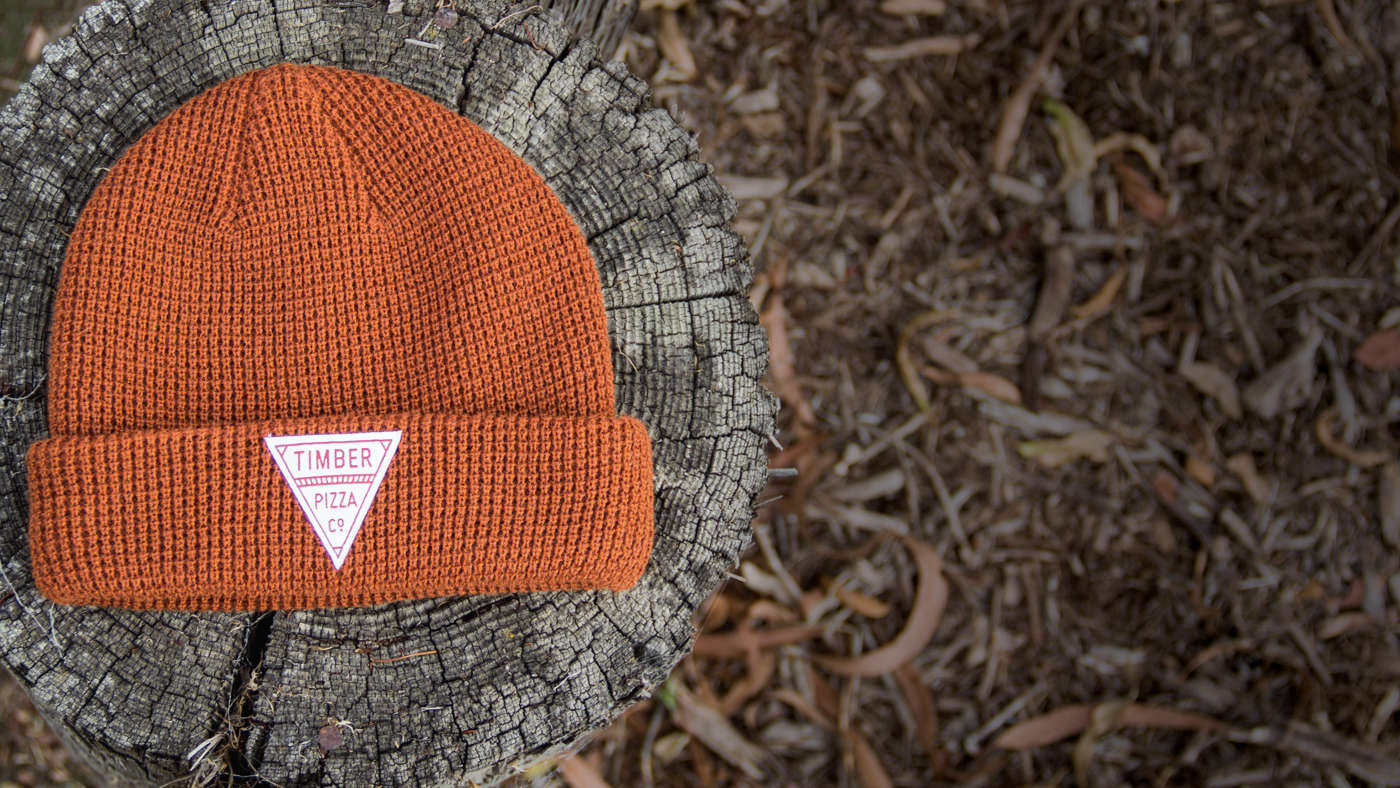 Wheelhouse / Waffle Knit laying on tree stump