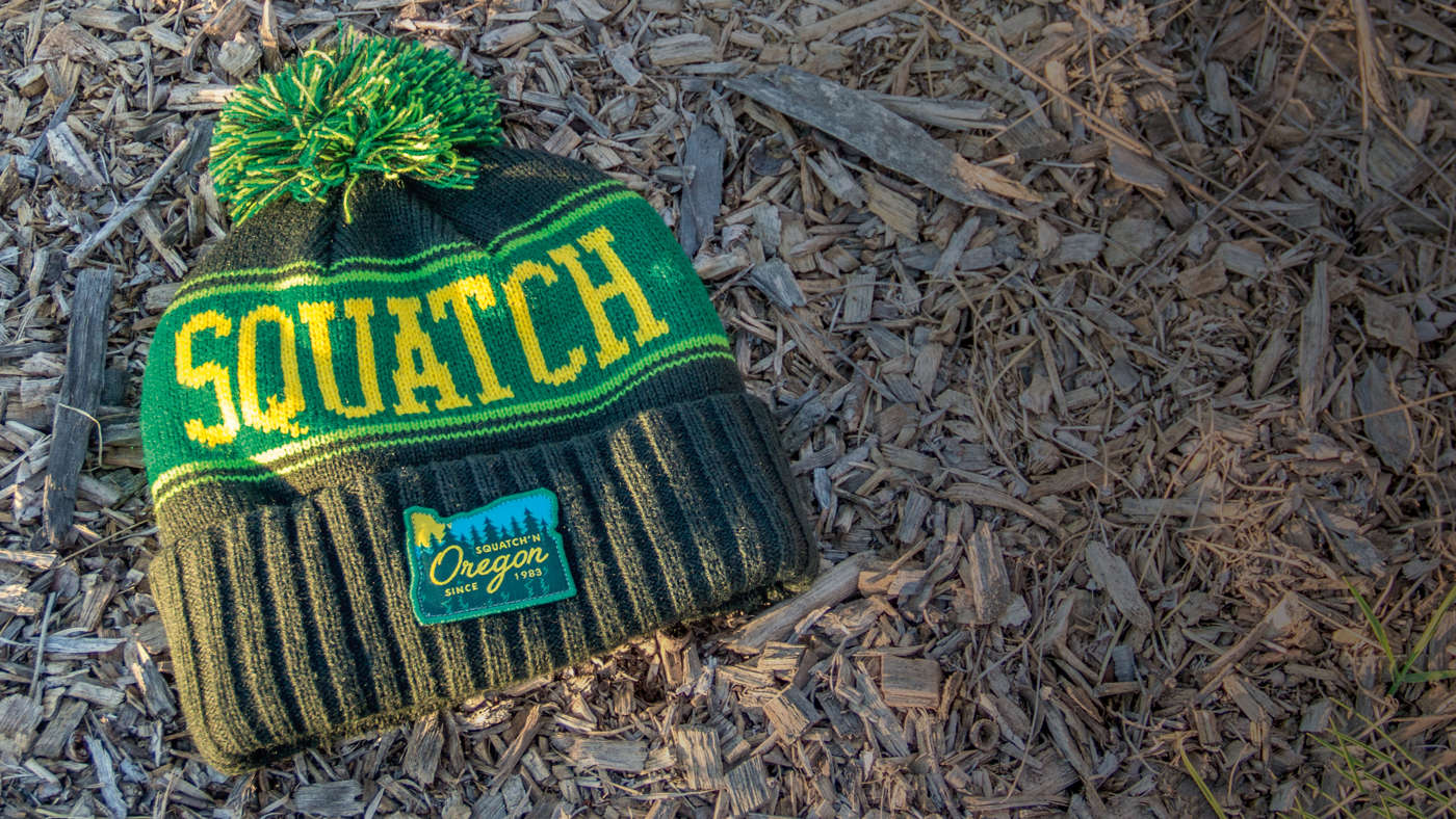 Toboggan / Vintage Knit laying on a bed of mulch