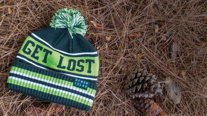 Cuffed Knit laying on pine needles